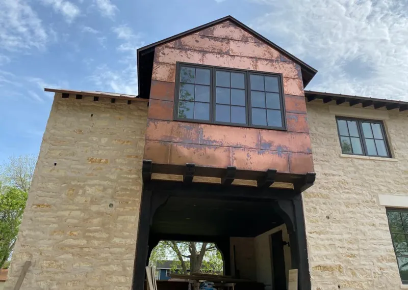 Copper metal panel facade on a stone building for Metal Roof Coating in Thousand Palms